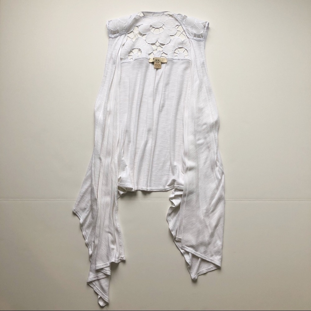 White flowy vest with lace detail. Size small